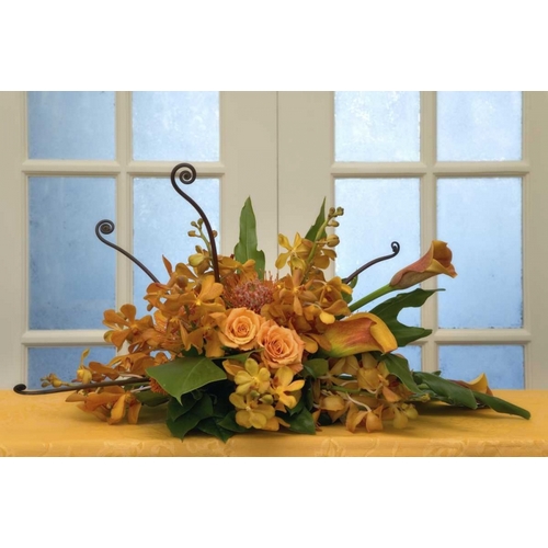 Flower arrangement on table in front of door